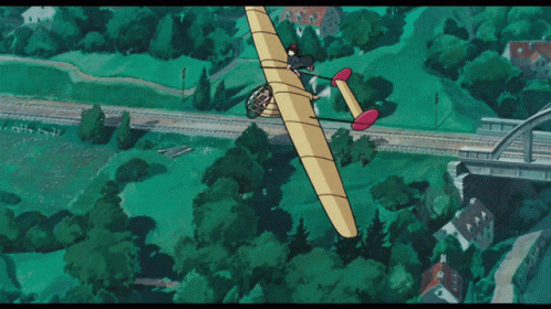 an old cartoon airplane that was flying over a park