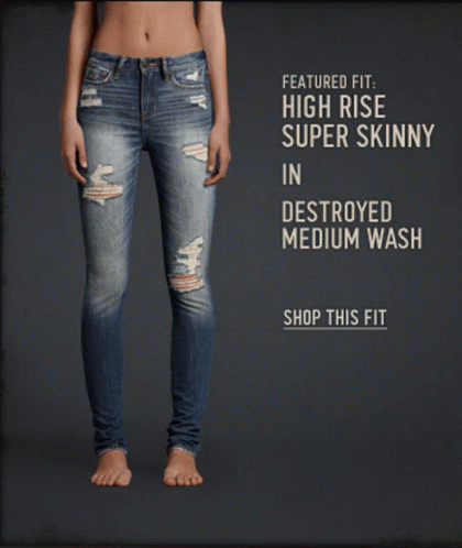 a woman is standing with her jeans destroyed