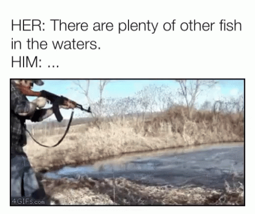 a man with a gun is standing near some water