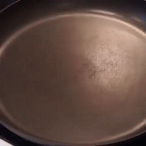 an empty pan on a stove cooking food