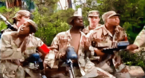 a group of military men wearing camouflage uniforms