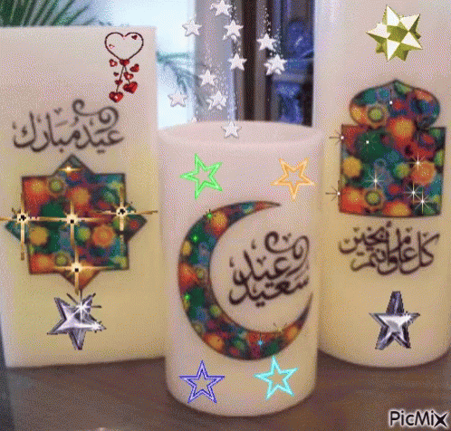 there are four decorative candles with stars in them