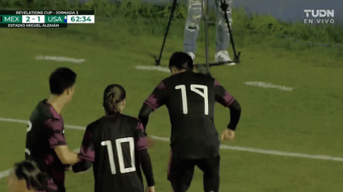 some soccer players have their numbers printed on them
