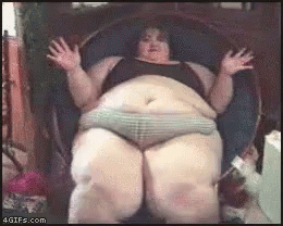a fat woman sitting in an empty chair