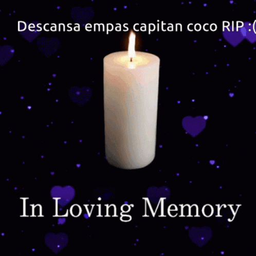 a candle is lit with the words in loving memory