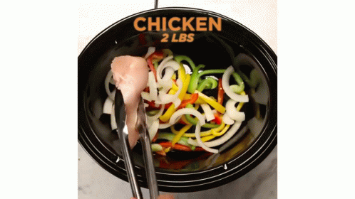 a bowl with noodles in it and spoons with the name chicken on it
