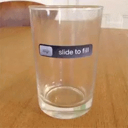a glass of water that is on the table