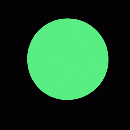 a glowing green dot that has been placed on a black background
