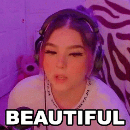 a girl wearing headphones with the words beautiful on her face