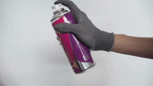 the person in gloves is holding a soda can