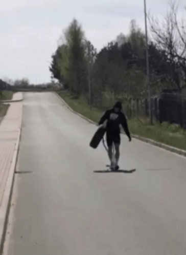 person riding a skateboard on a street