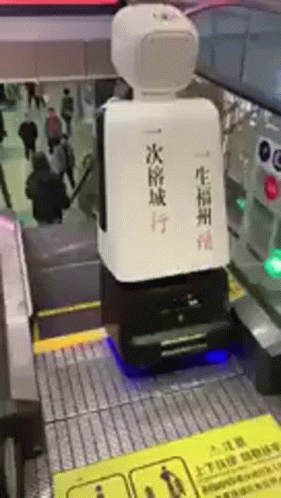 a person stands in a station while looking at some machines