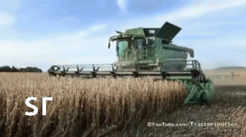 a combine in a field with the title of this image