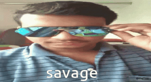 the man is wearing sunglasses with the word sevage on it
