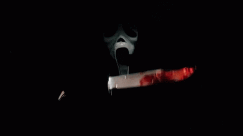 a ghost mask with a knife stuck in it