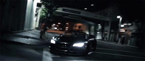 an bugatti on the road at night