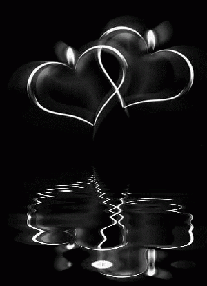 a couple of heart shapes that are reflected on water