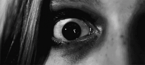an eye is seen in a black and white po