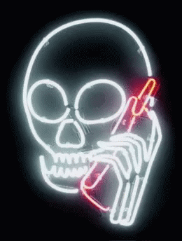 a neon skull with a cigarette in his mouth