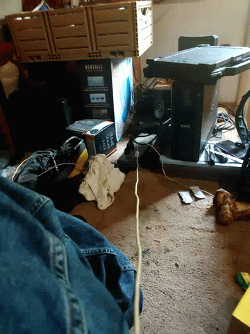 the room has various types of electronics and wires