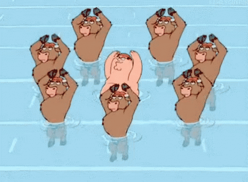 eight people with their hands on one holding another