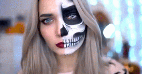 a woman in halloween makeup with skeleton makeup