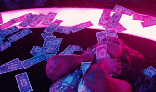 the woman is lying on the floor with money all over her face