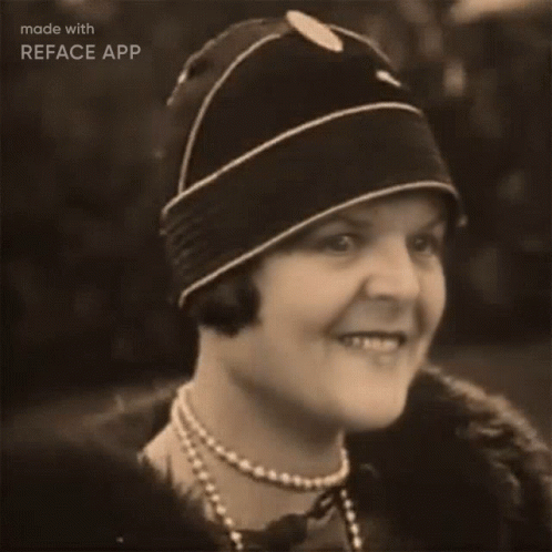 an old po of a woman wearing a hat