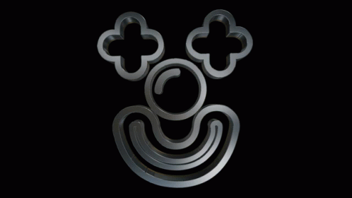 a picture of a metal logo with four crosses