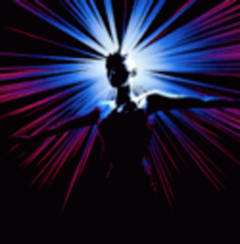 the back of a woman's body, holding her arms up to the side, illuminated with many beams of light above her