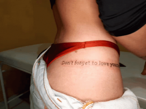 someone has tattooed her lower legs with the words don't forget to love you