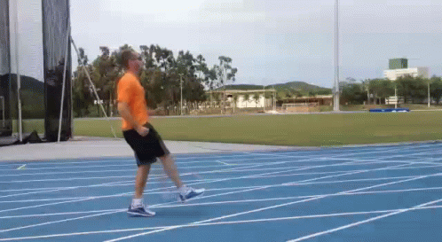 there is a man that is running on a track