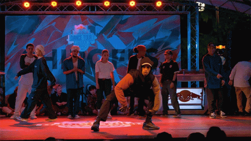 a group of people on a stage doing some tricks