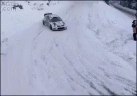 an suv traveling down a snow covered road
