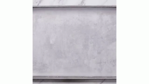 a marble slab sits against a white wall