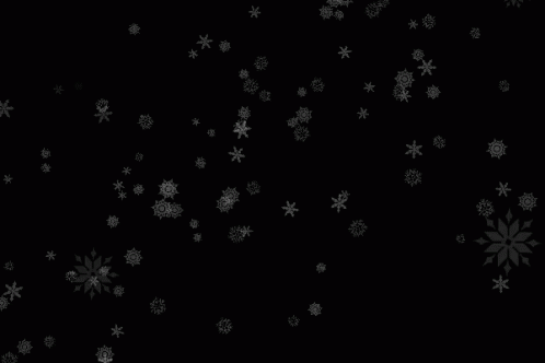 snow flakes fall on the surface and black background