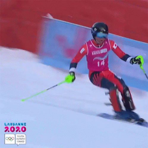 a skier skiing down the snow on a track