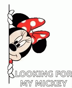 a mickey mouse holding onto a sticker with the words looking for my mickey
