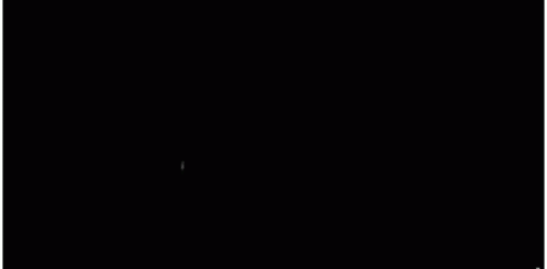 an airplane is flying through a dark black sky