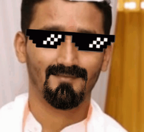 a man wearing a clock shaped sunglasses with pixellated pixels in the shape of squares