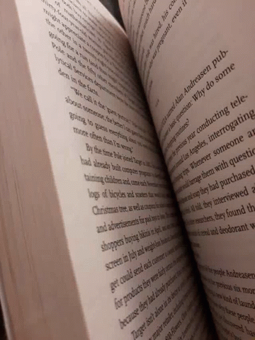 close up of a very large book with text
