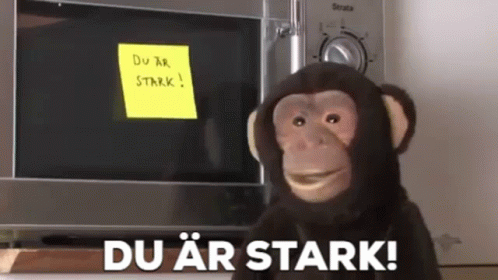 a monkey with a sign in its hand and a note that reads du air starke