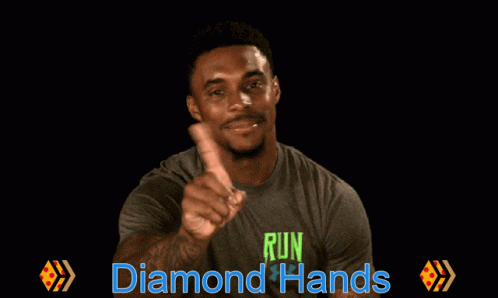 a black man pointing to the side with the caption run diamond hands
