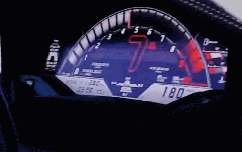 dashboard of a sports car with blue numbers
