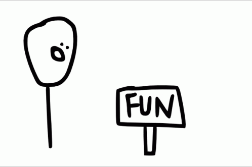a sign is standing next to a stick with a funny face