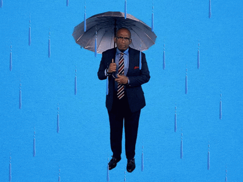 a blue man in business attire walking with an umbrella