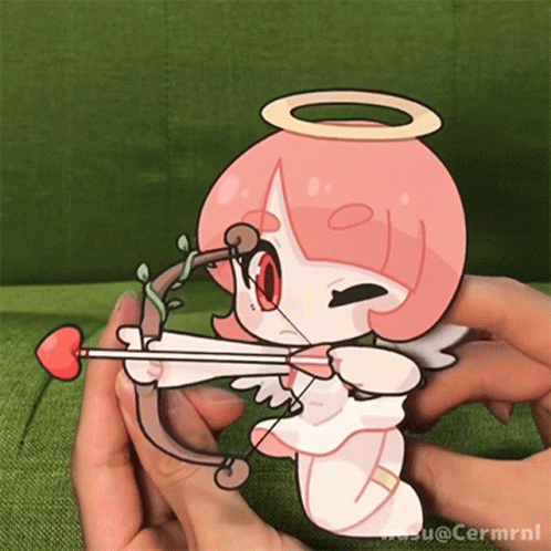 a little angel is playing with a bow