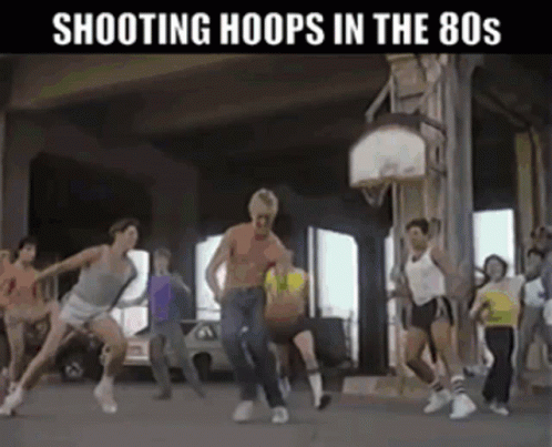 several men dancing around with a basketball on a court