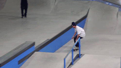 a skateboarder performing an ollie in an empty skate park