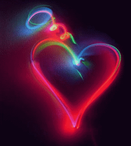 there is a colorful heart shape that appears to be light painting